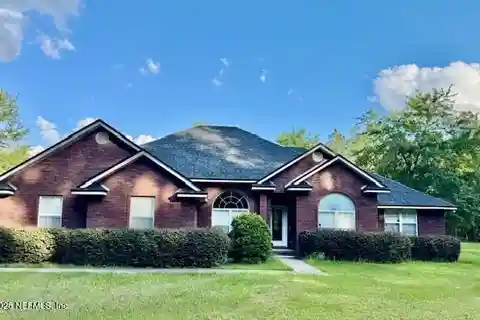 Meticulously Maintained Single-Story Brick Home on 20 Acres
