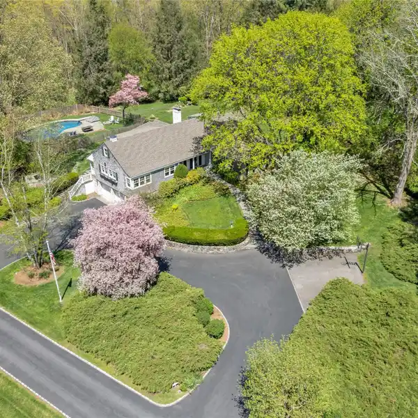 HAMPTONS-ESQUE CAPE COD ON VERDANT PROPERTY