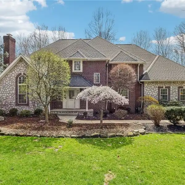 MAGNIFICENT BRICK AND STONE HOME ON OVER FOUR ACRES