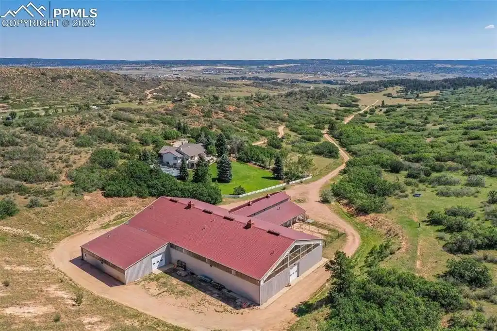 Sophisticated Ranch Home with Custom Arena and Barndominium