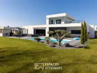 Architectural Gem Overlooking Golf Course Greens