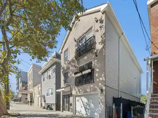 Lovingly Maintained Two-Family Townhouse in the Heart of Jersey City Heights