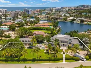 Fully Reimagined Estate on a Rare Corner Waterfront Lot