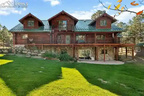 Secluded Log Estate with Waterfall Serenity