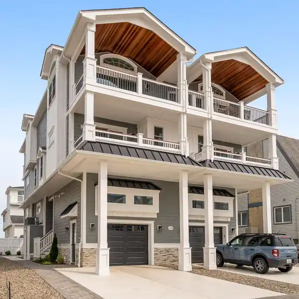 CUSTOM COASTAL RETREAT STEPS FROM THE BEACH
