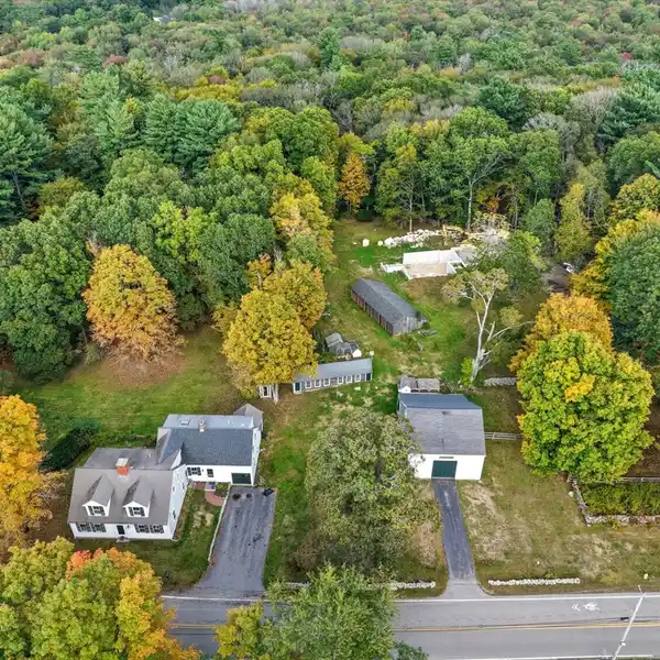 UNIQUE OFFERING WITH ANTIQUE HOME AND MULTIPLE OUTBUILDINGS