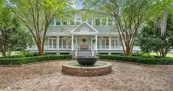 CRAFTSMANSHIP AND CHARM ON EXPANSIVE OAK-SPOTTED ESTATE