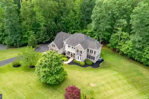 Elegant Colonial on Private 4-acre Wooded Lot