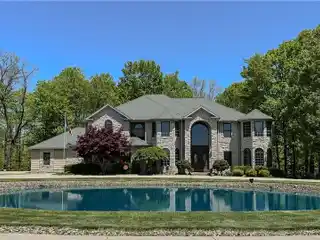 Exceptional Residence on over Five Wooded Acres