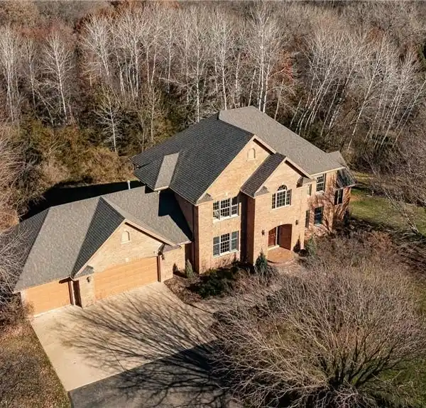 LOVELY HOME LOCATED ON A PRIVATE WOODED LOT