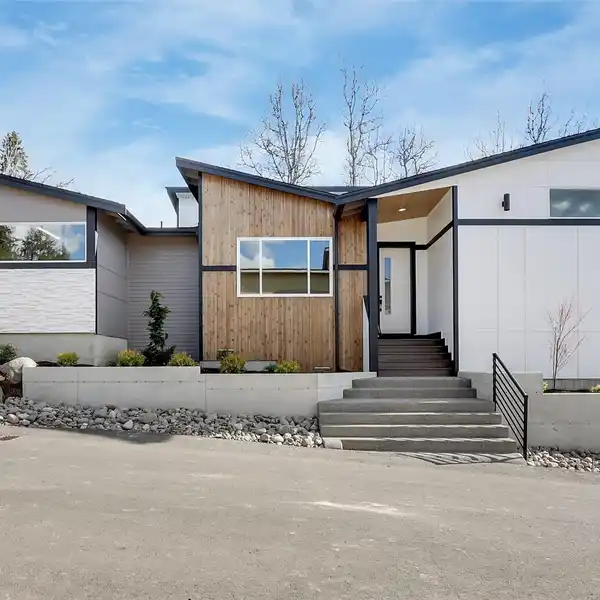 NEW ONE-STORY RAMBLER ON A CORNER LOT