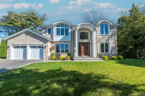 Distinguished Brick Colonial Flooded with Natural Light