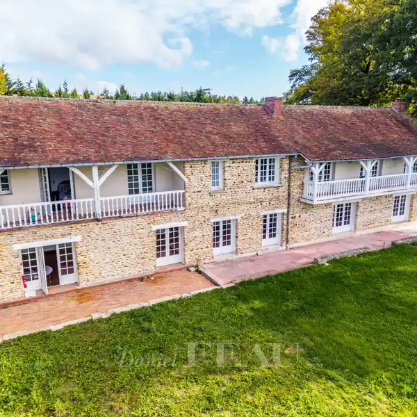 EXPANSIVE STONE RESIDENCE IN A LUSH SETTING