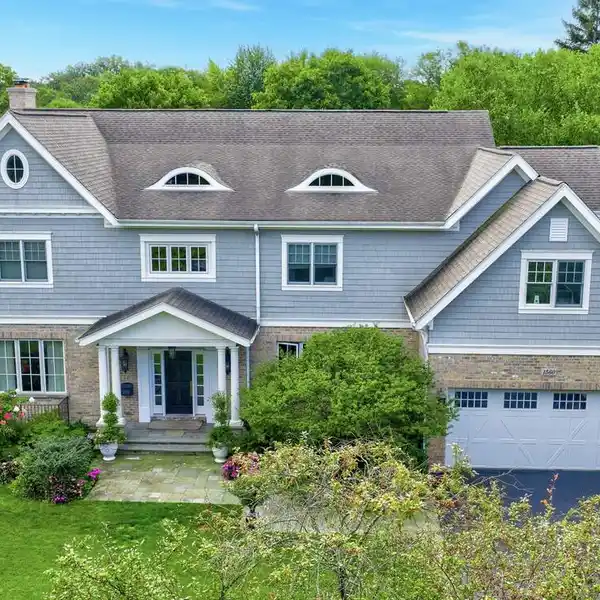 NANTUCKET-INSPIRED CUSTOM HOME BACKING TO CORWIN PARK