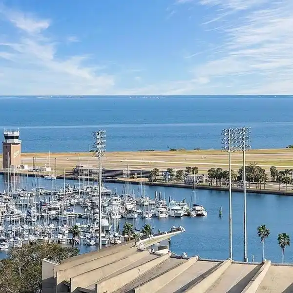OPEN CONCEPT LIVING WITH ELEGANT MARBLE KITCHEN