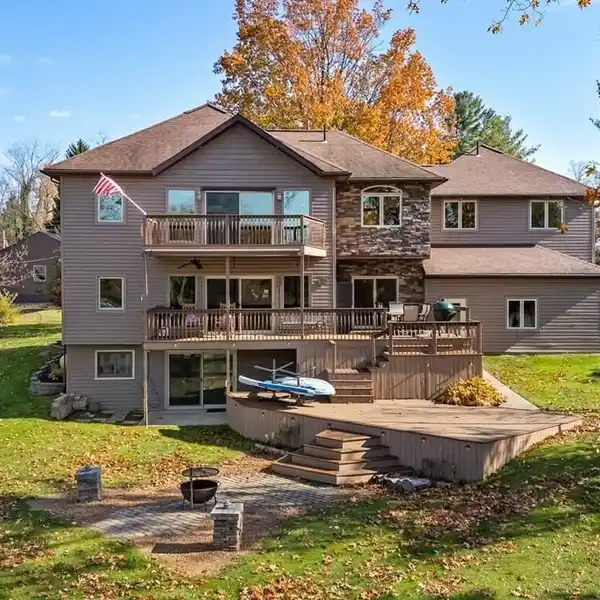 LAKEFRONT LIVING WITH YEAR-ROUND ELEGANCE