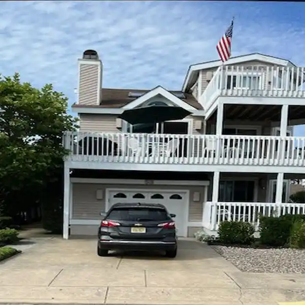 SPACIOUS THREE-STORY HOME THIRD FROM THE BEACH