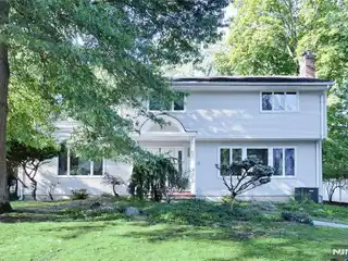 Well-Kept Center Hall Colonial Situated in a Prime Location