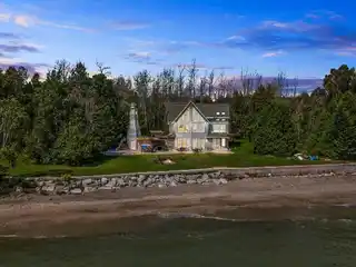 Grand Waterfront Retreat with Private Beach