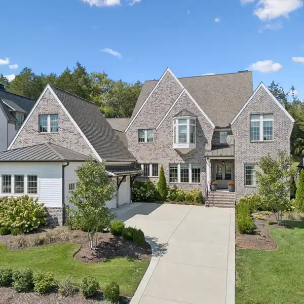 MODERN TUDOR-STYLE BRICK HOME IN THE GROVE