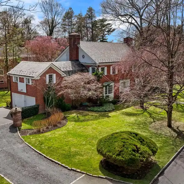 DISTINGUISHED BRICK COLONIAL IN GREENACRES