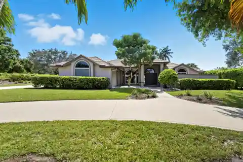 Elegant Gated Estate with Vaulted Light-Filled Interiors