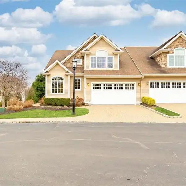 MOVE-IN READY CORNER UNIT IN THE HOLLOWS AT BLUE HILL