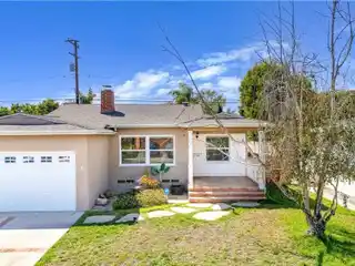 Charming Mid-Block Home with Dual Fireplaces and Modern Kitchen