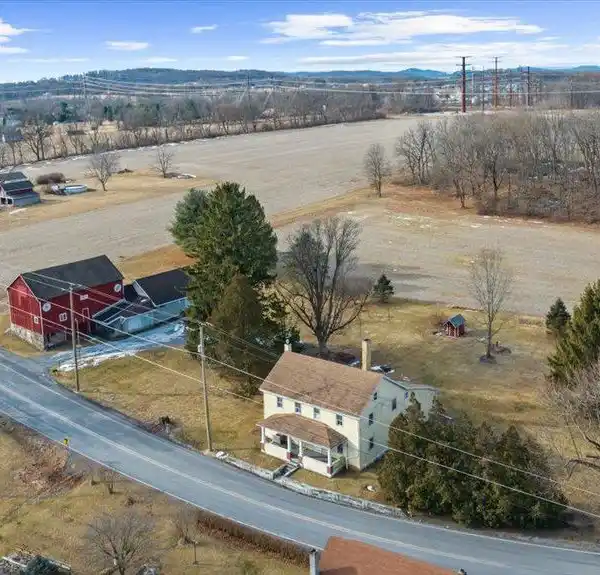 CLASSIC FARMHOUSE ON EXPANSIVE PRIME LAND
