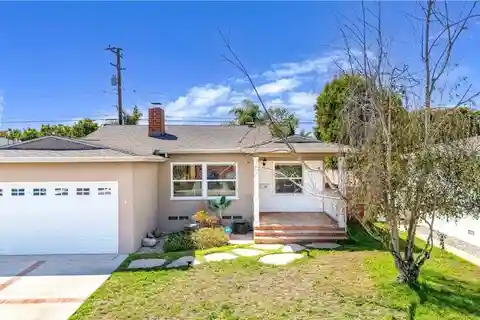 Charming Mid-Block Home with Dual Fireplaces and Modern Kitchen
