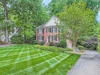 CHARMING BRICK HOME BACKING UP TO THE MYERS PARK GOLF COURSE