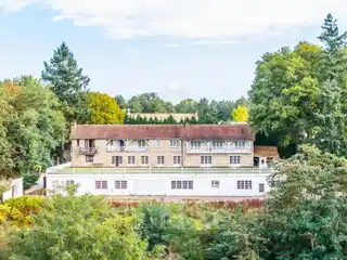 Expansive Stone Residence in a Lush Setting