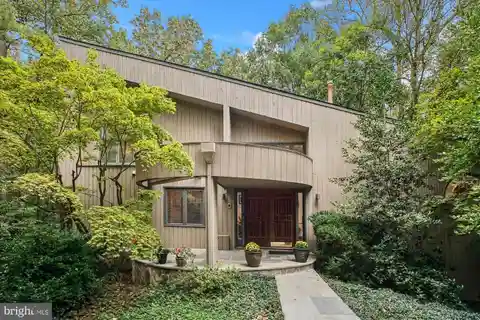 Nestled Among Mature Trees on a Beautifully Landscaped Corner Lot