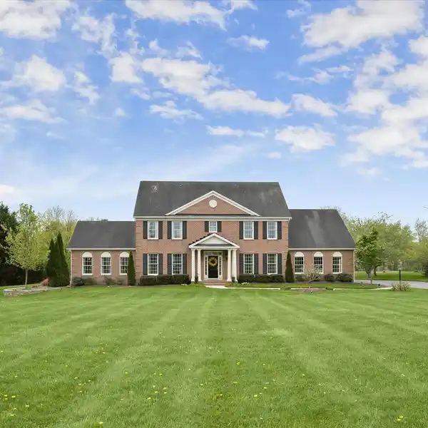 CUSTOM BRICK COLONIAL ON THREE ACRES