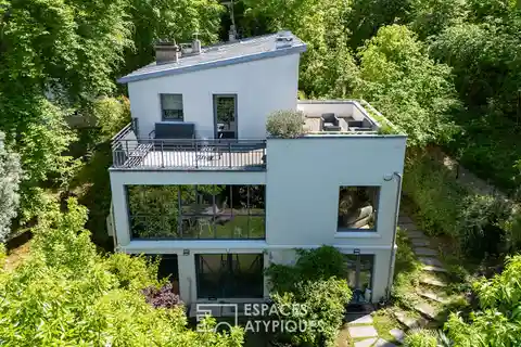 Elegant Glass-Roofed House with Garden Views