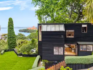 Architectural Coastal Haven Framed by Majestic Oak