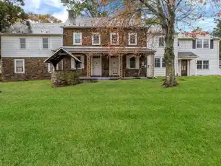 Brick Fireplace Anchors Formal Living Room