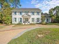 TWO-STORY HOME WITH REFINED ELEGANCE AND MODERN LUXURY
