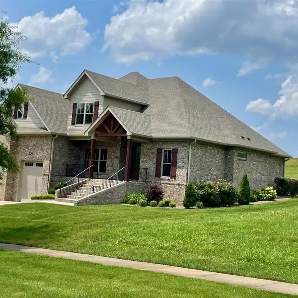 CUSTOM HOME IN THE PRESTIGIOUS OLDE STONE GOLF COURSE COMMUNITY
