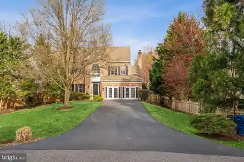 Luxe Brick Colonial with Backyard Paradise