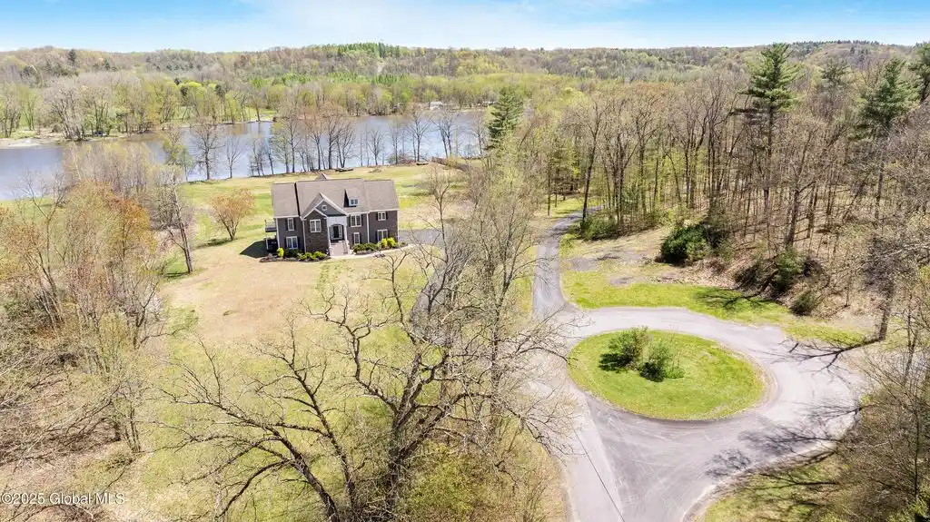 Comfortable Riverfront Living on over Three Acres