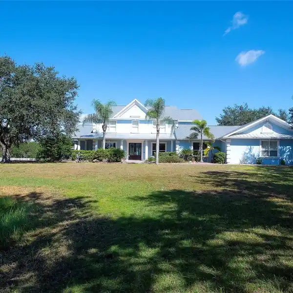 GATED LUXURY HOME WITH OAK-LINED DRIVEWAY
