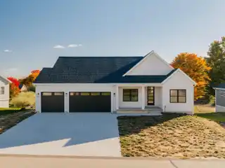 Modern West Traverse City Home with Quartz Counters & Shiplap Fireplace