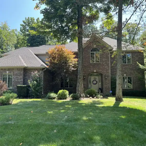 CUSTOM ALL-BRICK HOME ON A PREMIUM WOODED LOT