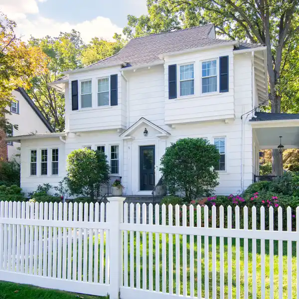 STUNNING WHITE COLONIAL SITS ON BEAUTIFUL CORNER LOT