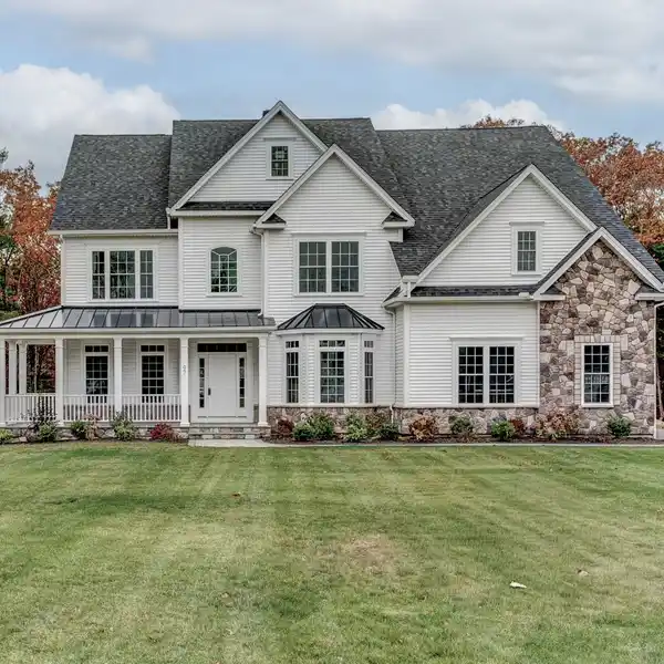 SOPHISTICATED COLONIAL WITH STRIKING ARCHITECTURAL DETAILS