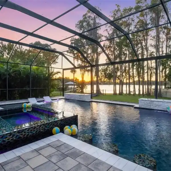 LAKEFRONT LUXURY WITH RESORT-STYLE POOL AND SUNSET VIEWS