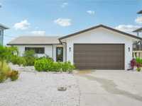 REMODELED WATERFRONT POOL HOME IN PRIME LOCATION