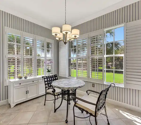 UPPER-FLOOR END UNIT WITH PANORAMIC GOLF AND WATER VIEWS