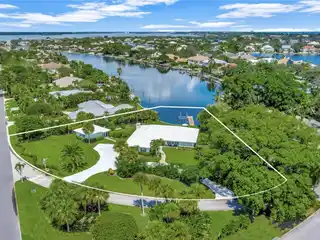 Prestigious Waterfront Living with Lush Backyard